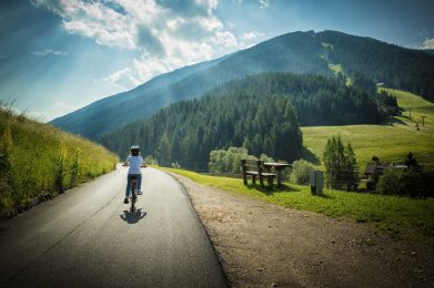 Young,Girl,Riding,Her,Bicycle,Along,The,Street,That,From